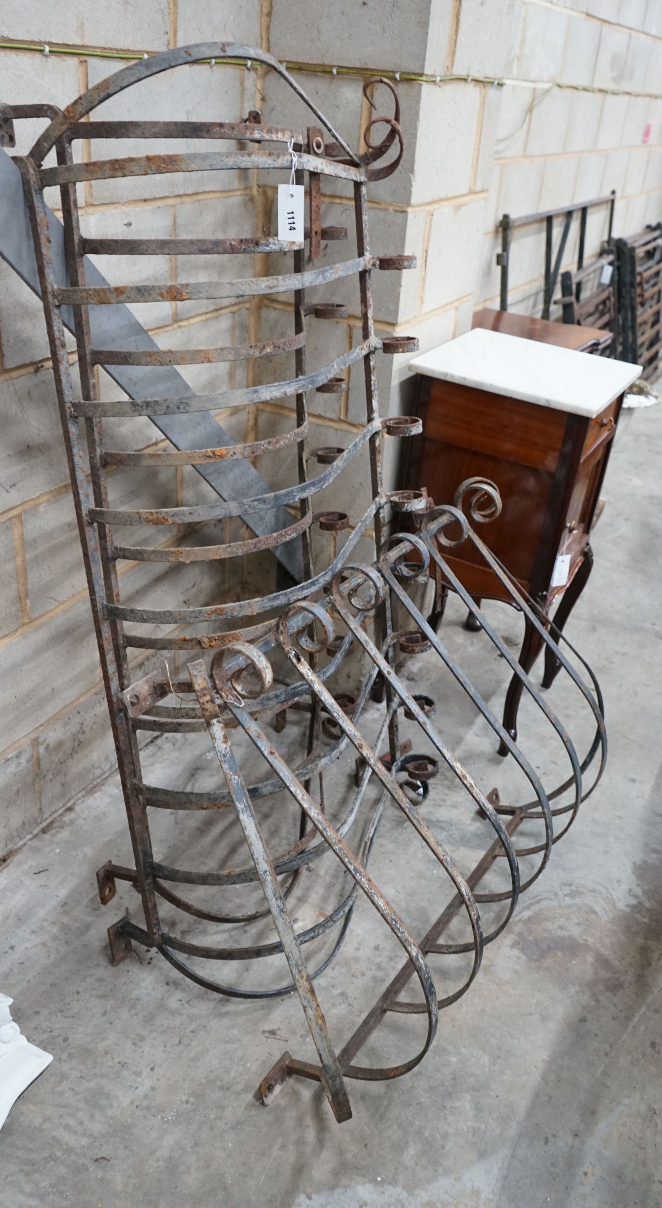 Three vintage wrought iron scrolling balcony railings, largest width 145cm, height 70cm